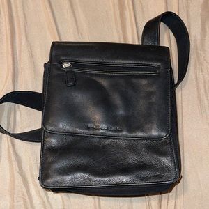 Fossil leather messenger bag. Indent on leather shown in last picture.